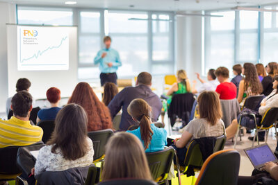 31763231 - speaker at business workshop and presentation with audience at the conference room.
