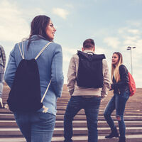 Group of Students with Backpacks Walking to School